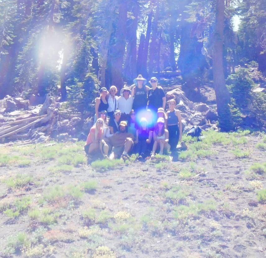 A small group gathered on the mountain with an unexplained point of light