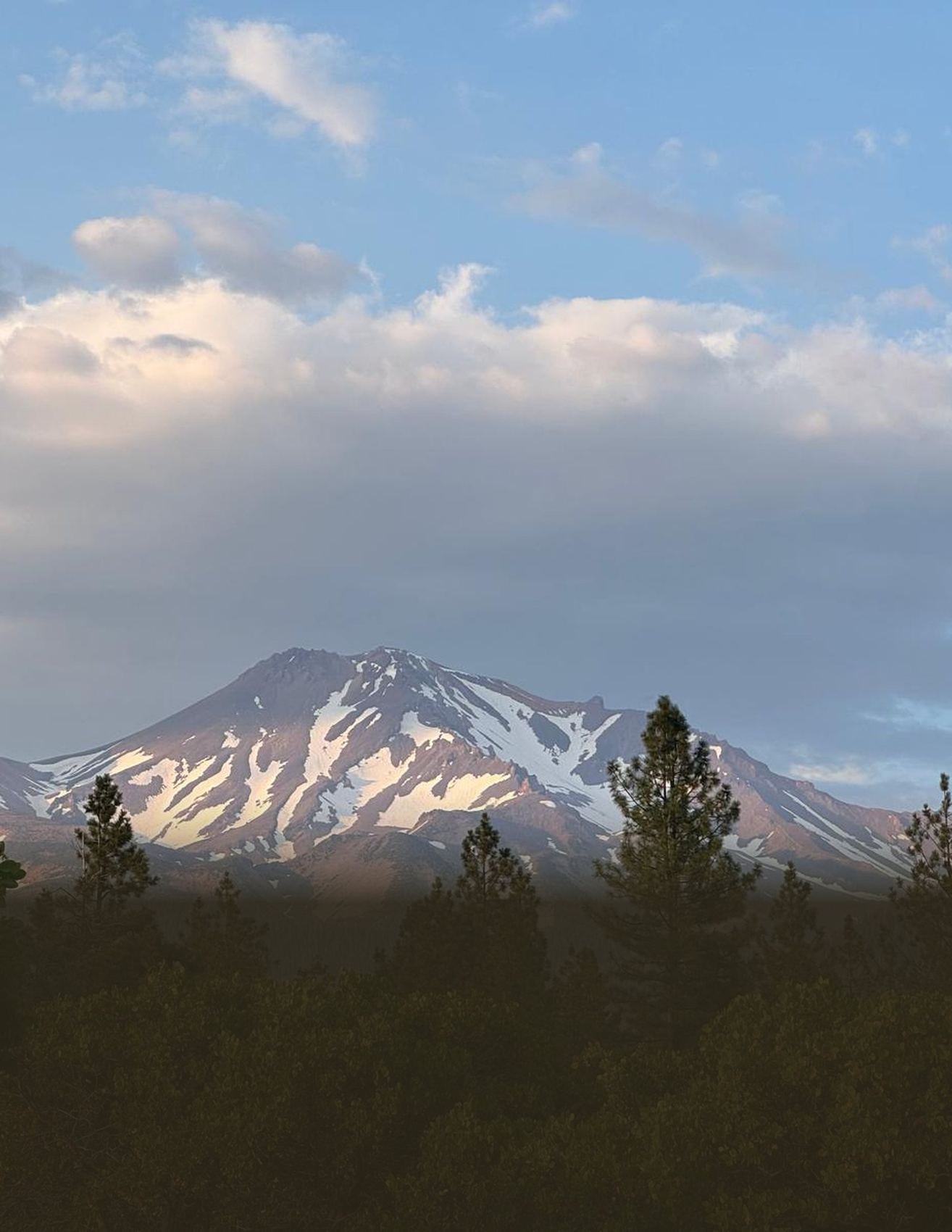 Mount Shasta beneath a wide sky of cloud